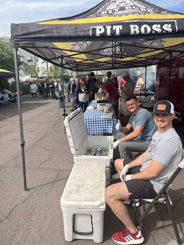 volunteers under tent at event